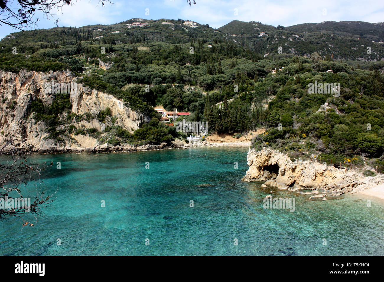 Ampelaki Bay in the seaside resort of Palaiokastritsa in northern Corfu, one of the Ionian Islands of Greece. Stock Photo