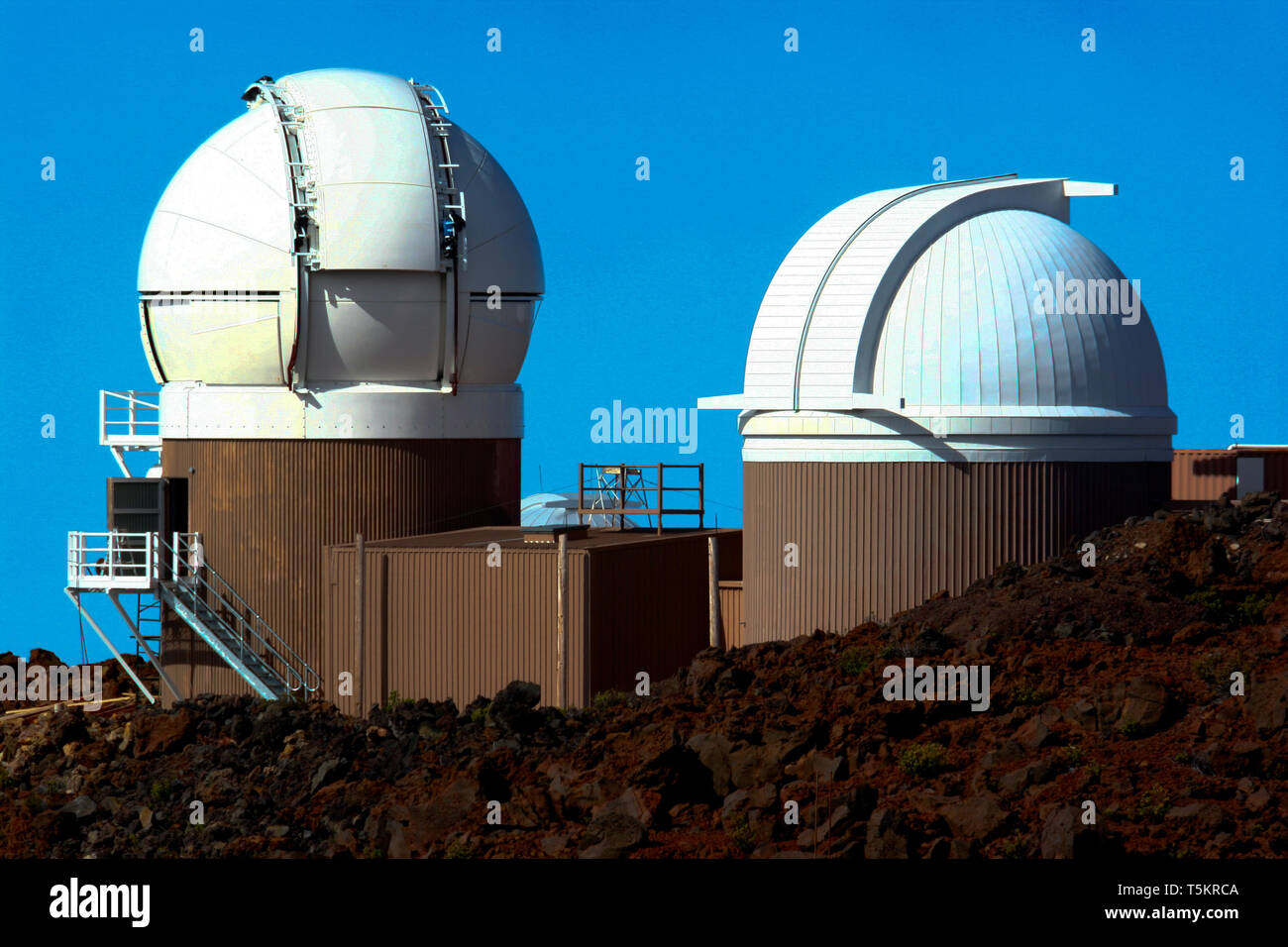 The Air Force Maui Optical and Supercomputing site at Haleakala Observatory in Hawaii. Facilities shown are the two Pan STARRS optical observatories. Stock Photo