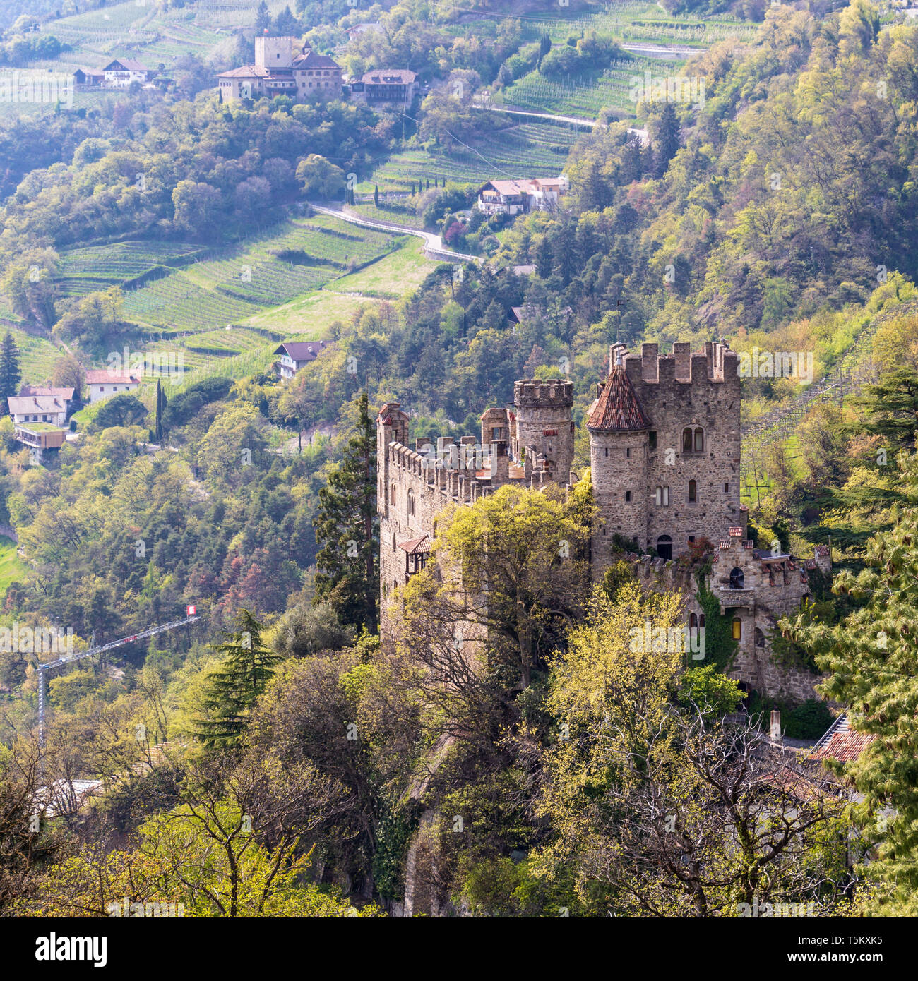 View on Castle Brunnenburg inside Valley and Landscape of Meran. Tirol Village near Merano, Province Bolzano, South Tyrol, Italy. Stock Photo