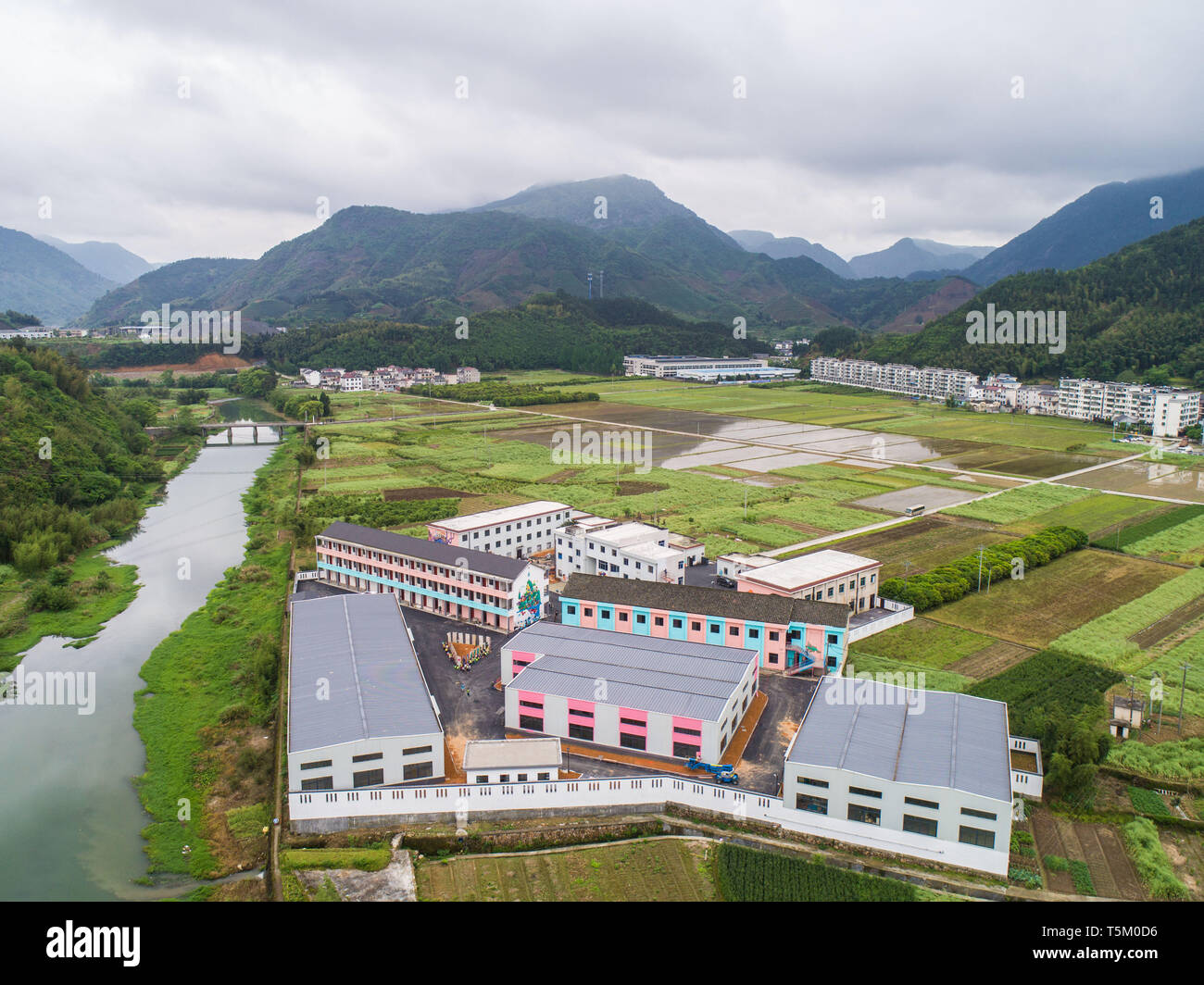 Chun'an. 25th Apr, 2019. Aerial photo taken on April 25, 2019 shows an art zone in Dashu Township of Chun'an County in Hangzhou, east China's Zhejiang Province. Artists and art students have been creating artwork in recent days in an art zone transformed from old factory buildings with a total area of over 10,000 square meters. The art zone will be open to public in early May. Credit: Xu Yu/Xinhua/Alamy Live News Stock Photo
