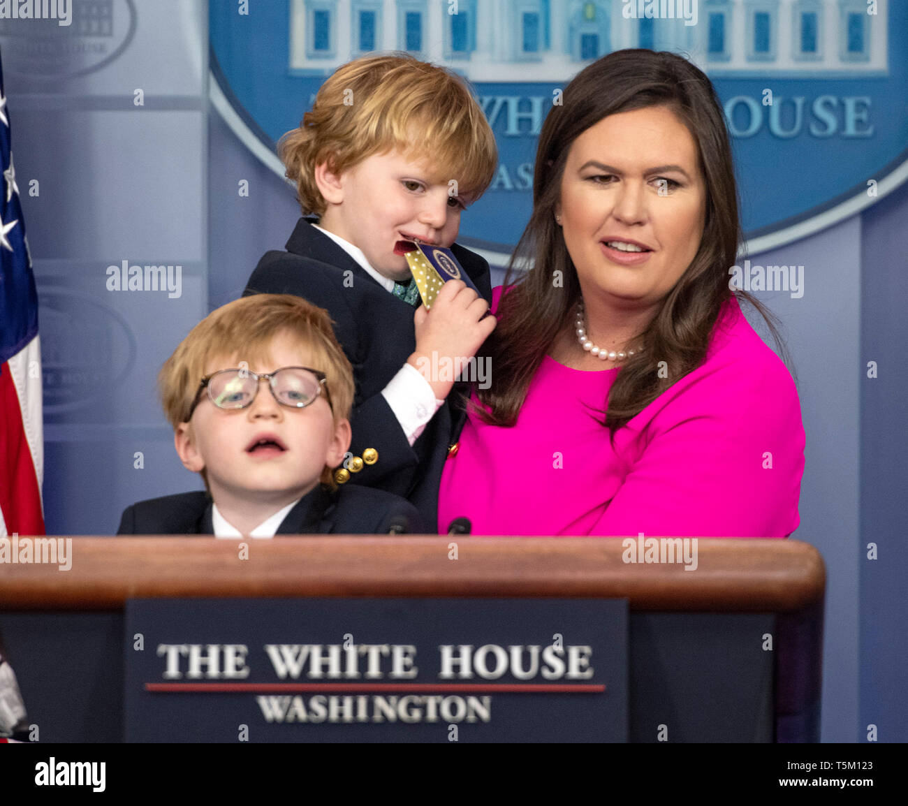 Washington, United States Of America. 25th Apr, 2019. White House Press Secretary Sarah Huckabee Sanders, with her sons, Huck Sanders, lower left, and George Sanders, center, takes questions from children of White House staff and journalists in observance of "Take Our Daughters and Sons to Work Day" in the Brady Press Briefing Room of the White House in Washington, DC on April 25, 2019. Credit: Ron Sachs/Pool via CNP | usage worldwide Credit: dpa/Alamy Live News Stock Photo