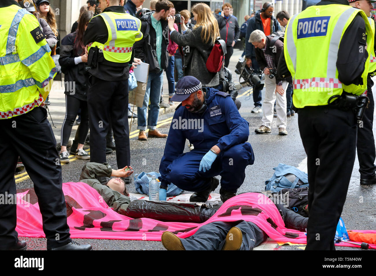 London, UK, UK. 25th Apr, 2019. Environmental activists from Extinction Rebellion Movement Group are seen glued together during the protest.The eleventh day of the ongoing protest demanding decisive action from the UK Government on the environmental crisis. Credit: Dinendra Haria/SOPA Images/ZUMA Wire/Alamy Live News Stock Photo
