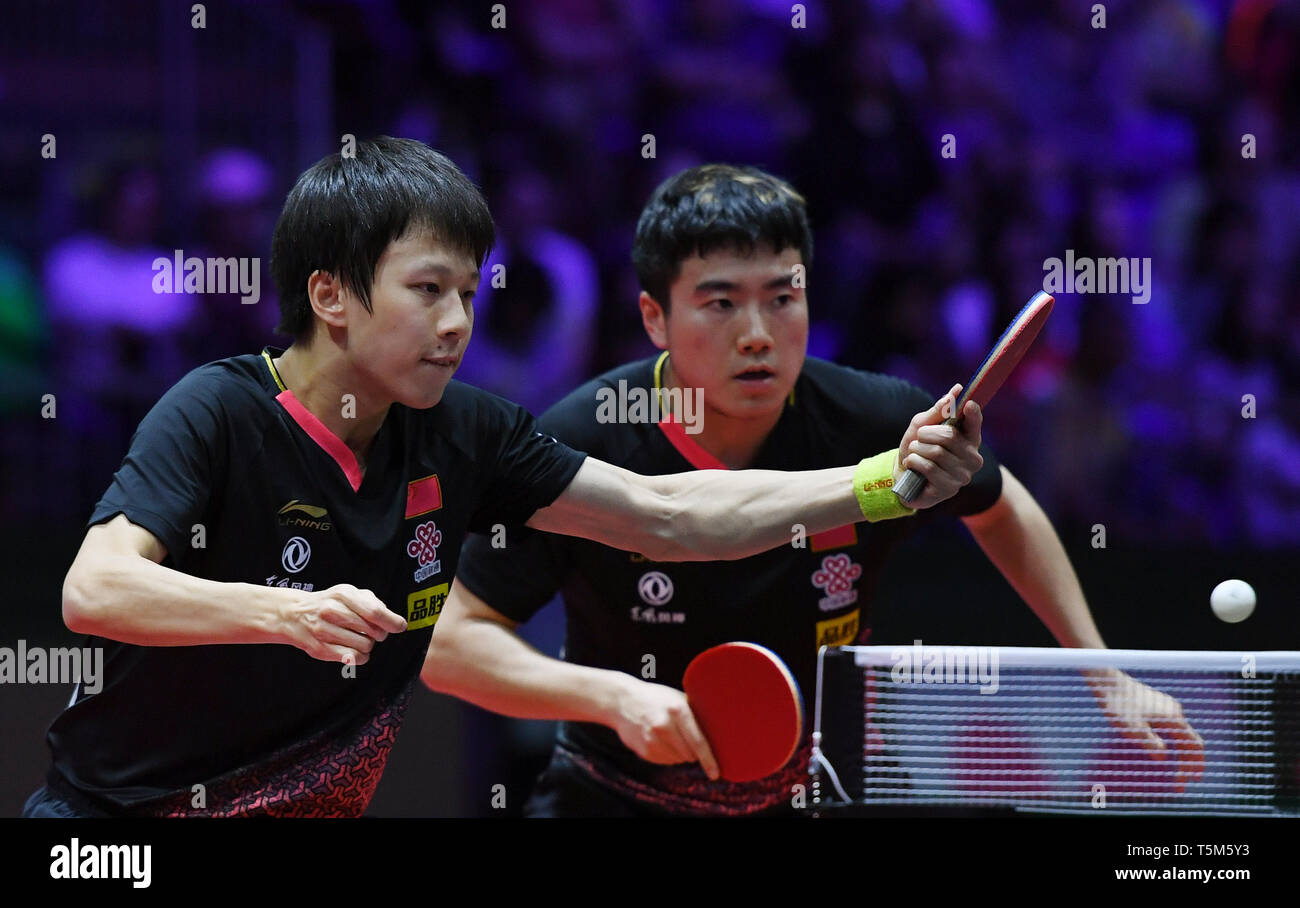Budapest. 25th Apr, 2019. Liang Jingkun/Lin Gaoyuan (L) of China compete  during the men's doubles quarterfinal match against Wong Chun Ting/Ho Kwan  Kit of China's Hong Kong at 2019 ITTF World Table