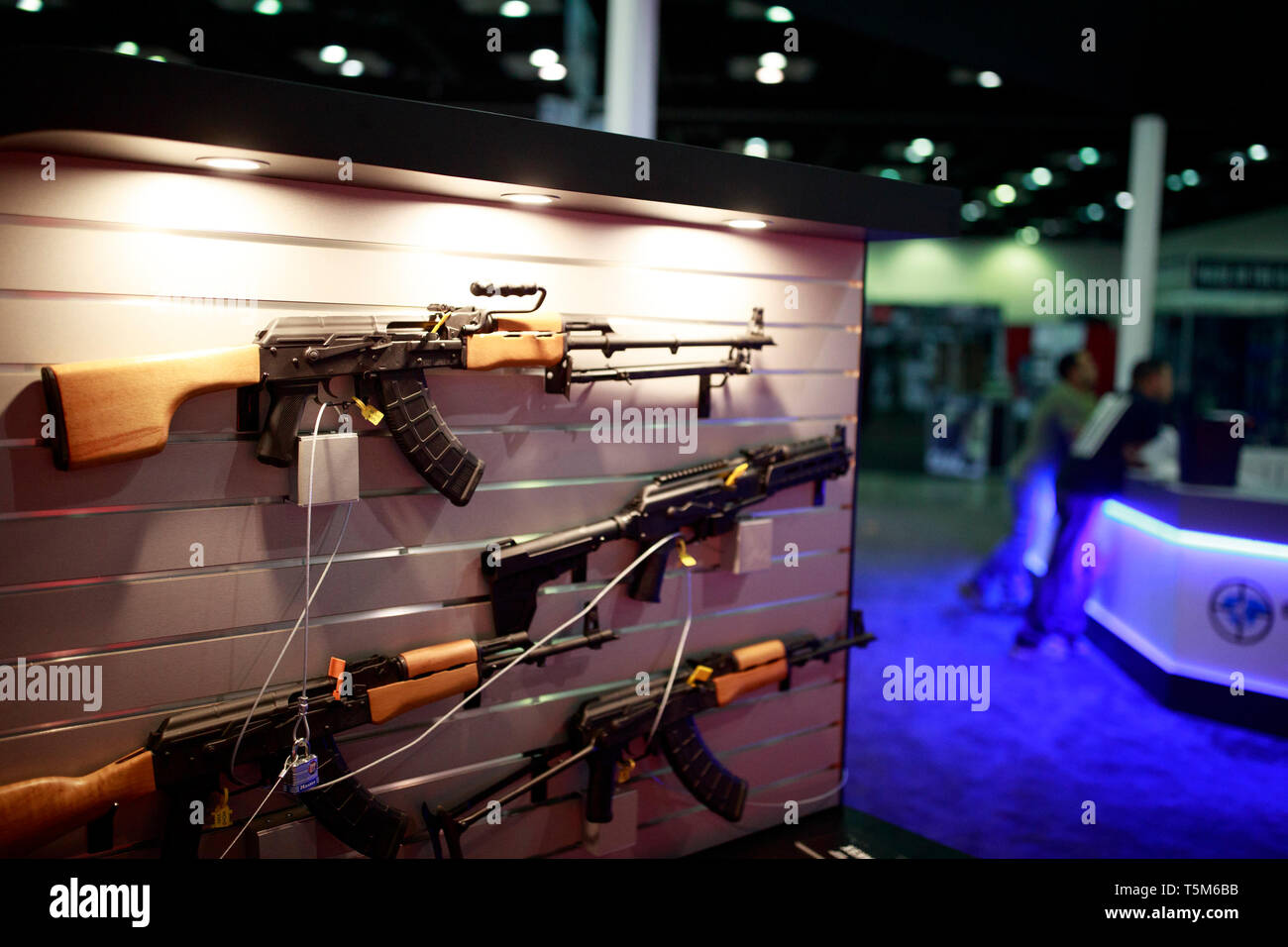 Eastern Bloc style AK platform rifles are on display at the Century Arms booth. Vendors prepare booths in the exhibition hall before the National Rifle Association (NRA) convention at the Indiana Convention Center in downtown Indianapolis. Stock Photo