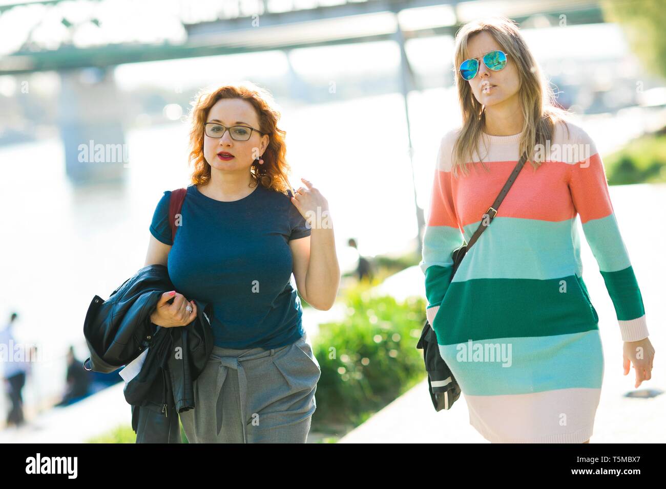 Two women walking lake hi-res stock photography and images - Alamy