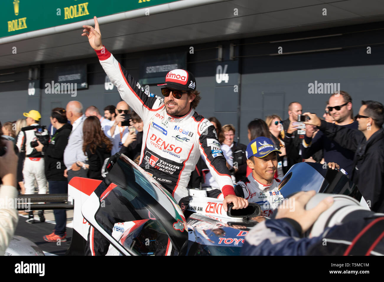 Fernando Alonso and Kamui Kobayashi celebrate victory with their car in the pit lane, WEC 6 Hours of Silverstone, 2018 Stock Photo