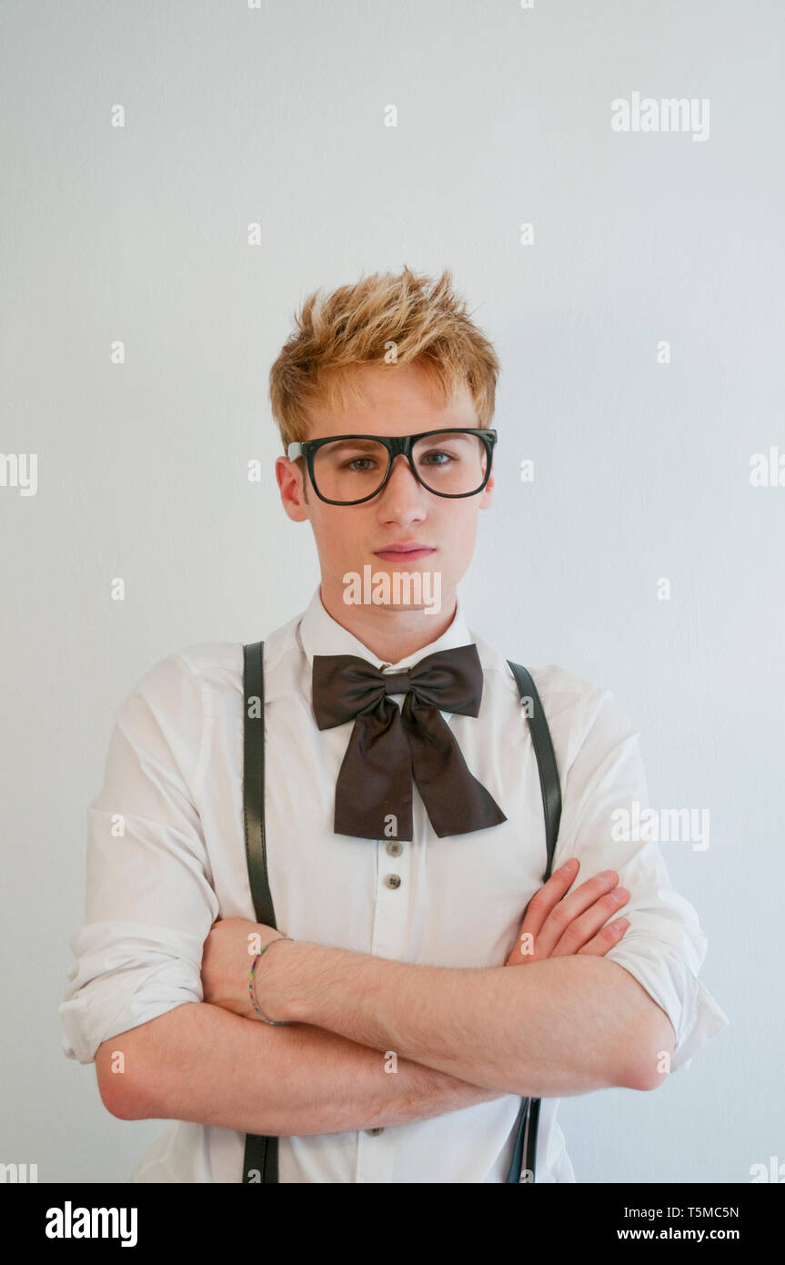 Portrait of young man wearing big spectacles and crossing arms. Stock Photo