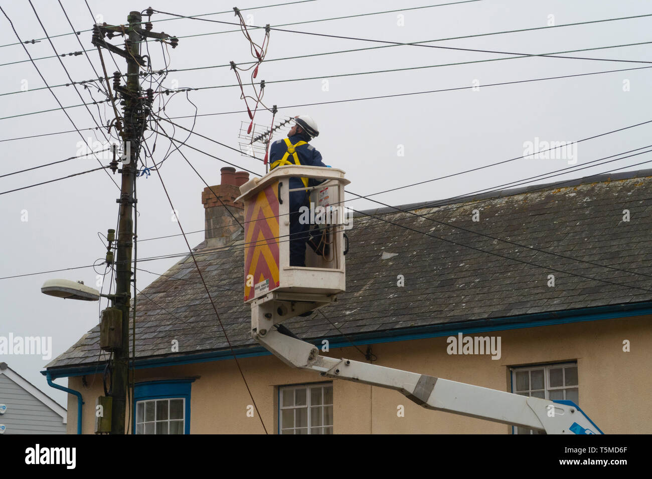 Workers for Western Power Distribution working to replace telegraph poles and electricity cables in Sidmouth, Devon, UK Stock Photo