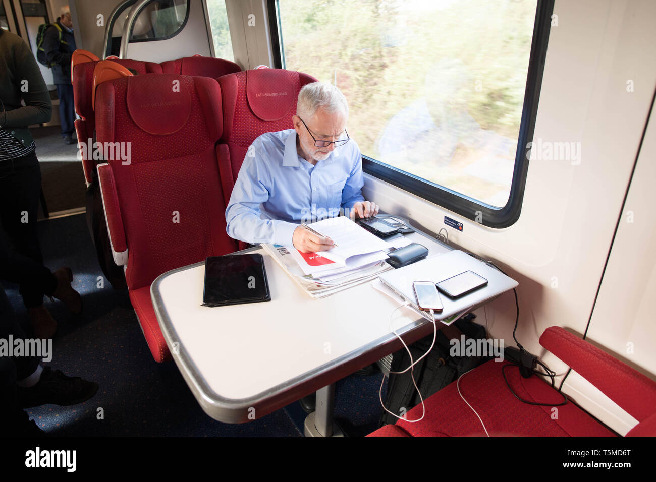 Labour leader, Jeremy Corbyn takes the train back to London after visiting Nottingham where he saw an 'eco bus' run by Nottingham City Transport Ð the cityÕs municipal bus company. Stock Photo