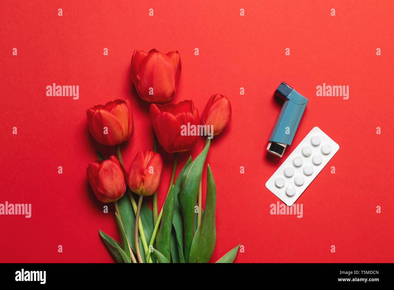Asthma inhaler and bouquet of flowers with copy space Stock Photo Alamy