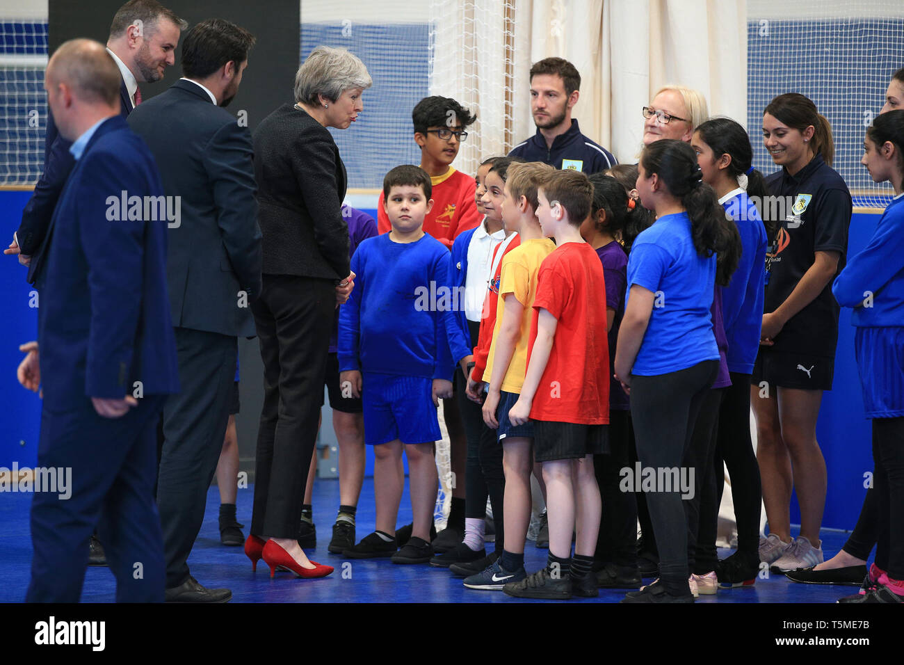 Prime Minister Theresa May (centre left) talks to local children during a visit to the Leisure Box in Brierfield, Lancashire, while on the local elections campaign. Stock Photo