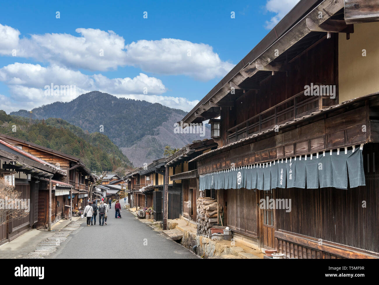 Main street in the old Edo era post town of Tsumago, Nagasendo, Kiso Valley, Nagano Prefecture, Japan. The town is part of the Magamo-Tsumago hike. Stock Photo