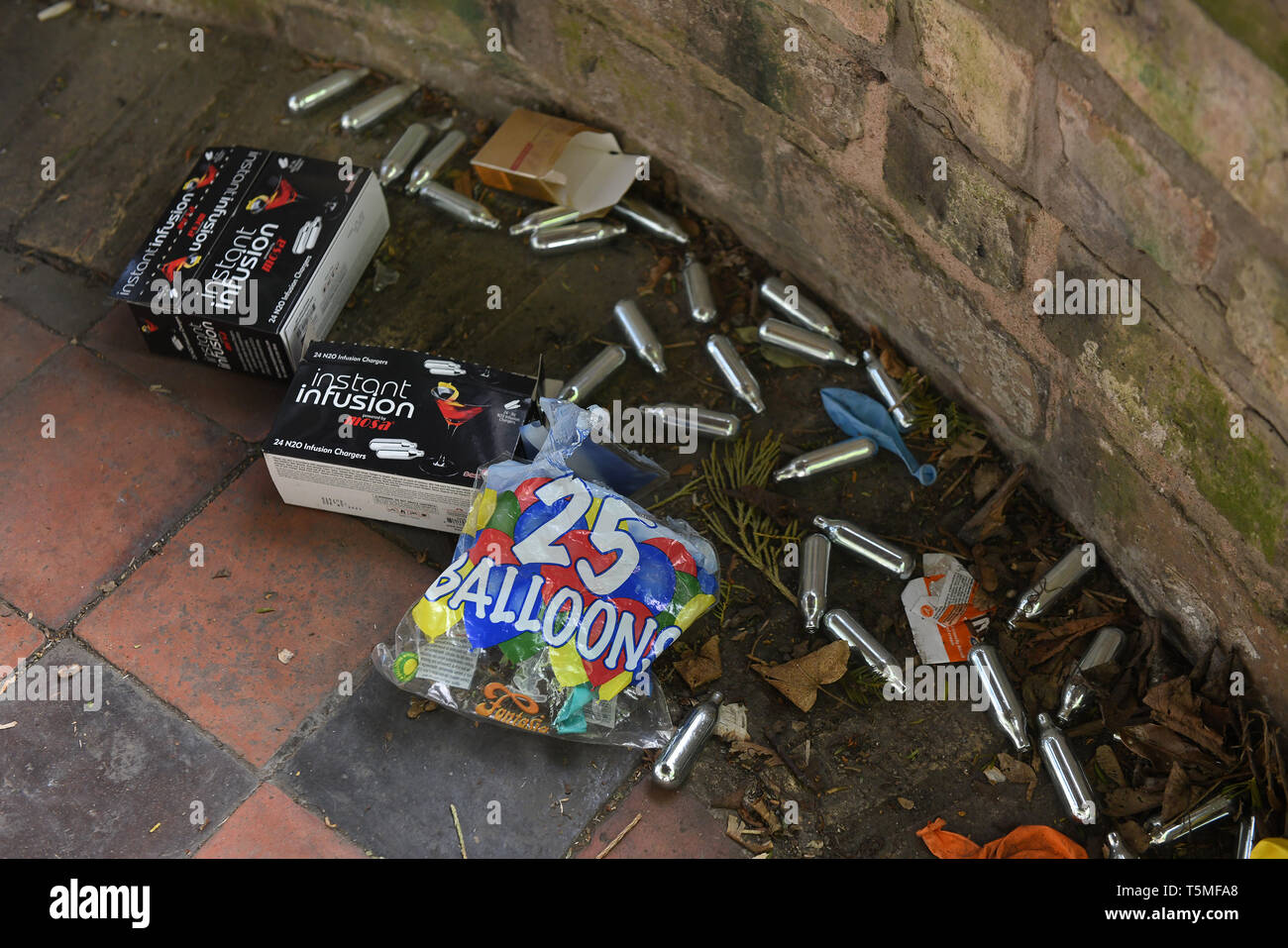 Nitrous oxide also known as Laughing Gas containers dumped in public park after being used 'Hippy Crack' Britain, Uk, 2019 Stock Photo