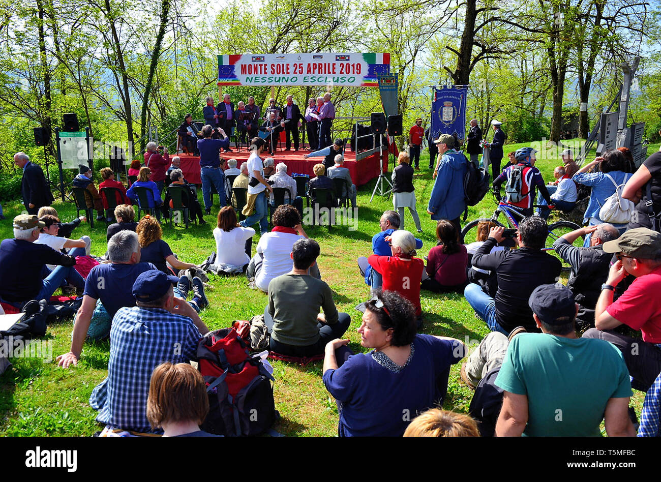 The yearly meeting takes place on April 25th, on the vast meadows of Monte Sole, to celebrate the liberation from fascism and  nazism. Official ceremonies take place all over Italy on this date, but the one in Marzabotto is always very crowded, because that rural area was completely destroyed and 1830 people were killed by SS and fascists. After the partisan songs of the 'Scariolanti' the Mayor's salute and the local priests' blessing, two speakers from the stage : the historian, philosopher and political man Massimo Cacciari and the general of the Yugoslav Army Jovan Divjak  that defended Ser Stock Photo