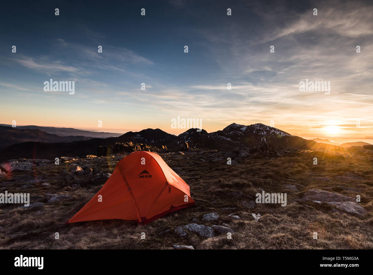 Tent in the mountains with Snowdon in the background, Wales Stock Photo