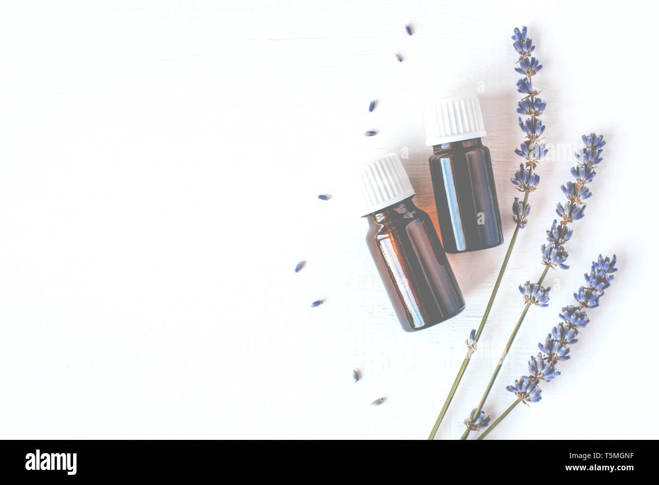 Dried lavender with a bottle of essential oil on white background Stock ...