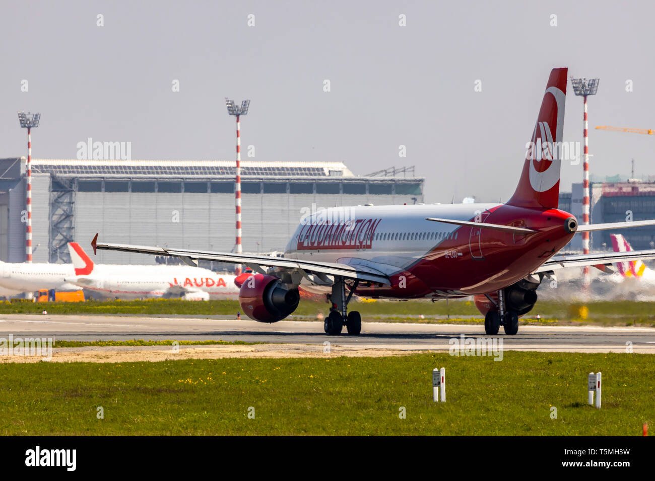Dusseldorf International Airport, DUS, Lauda Airplane, Laudamotion, Airbus A320, on the taxiway, air traffic control tower, terminal building, Stock Photo