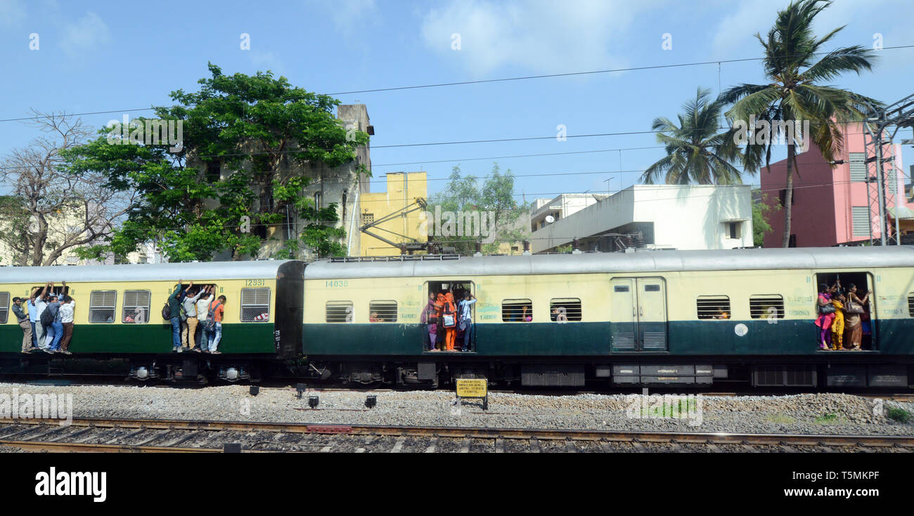 Commuters on a local train on their way to Chennai, India Stock Photo