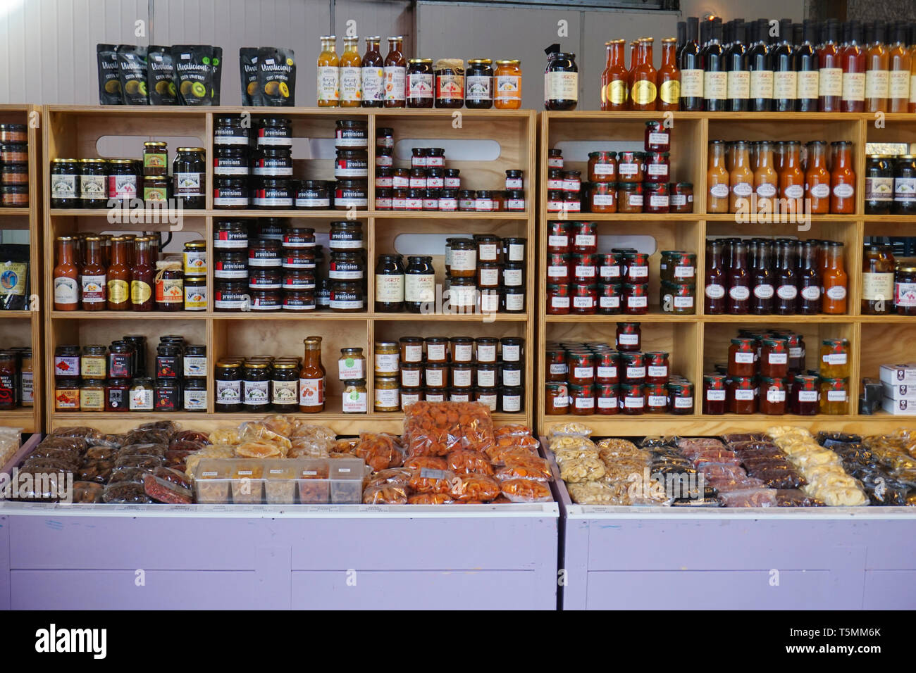 Cromwell/ New Zealand:Jam fruit jar on wooden shelf strawberry apricot raspberry homemade fresh preserve on farmer market Stock Photo