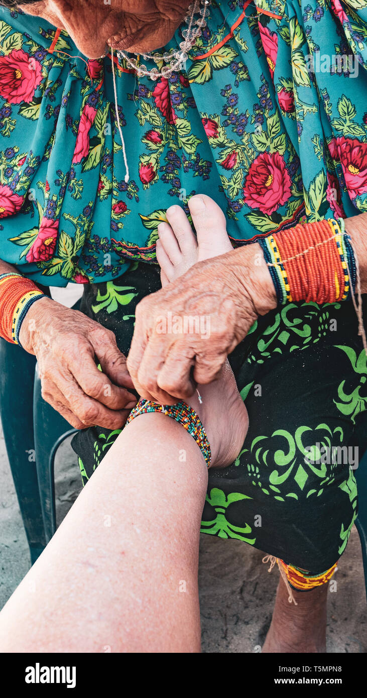 Guna aka Kuna indian artist wearing traditional garb and wrist
