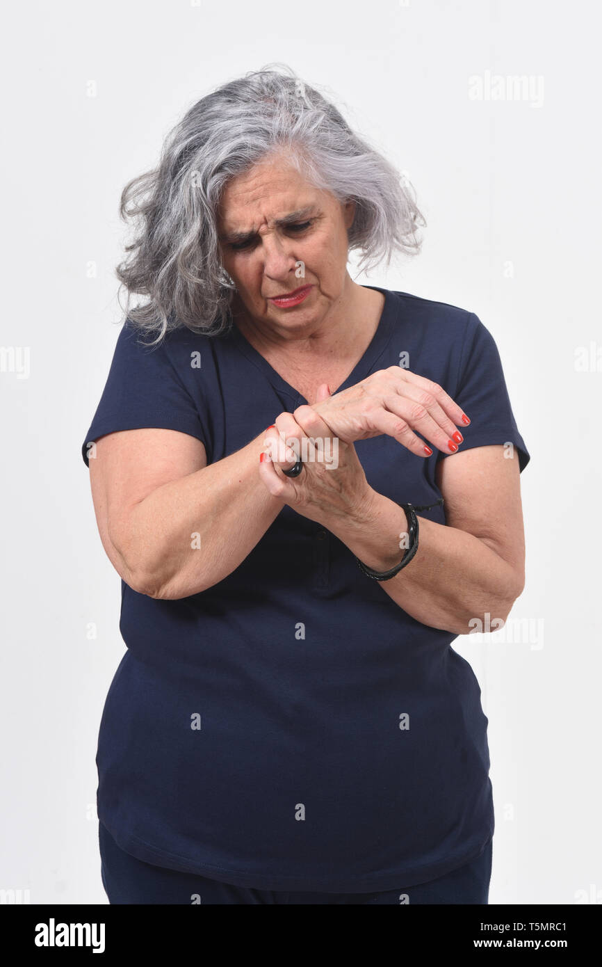 woman with pain on wrist on white background Stock Photo