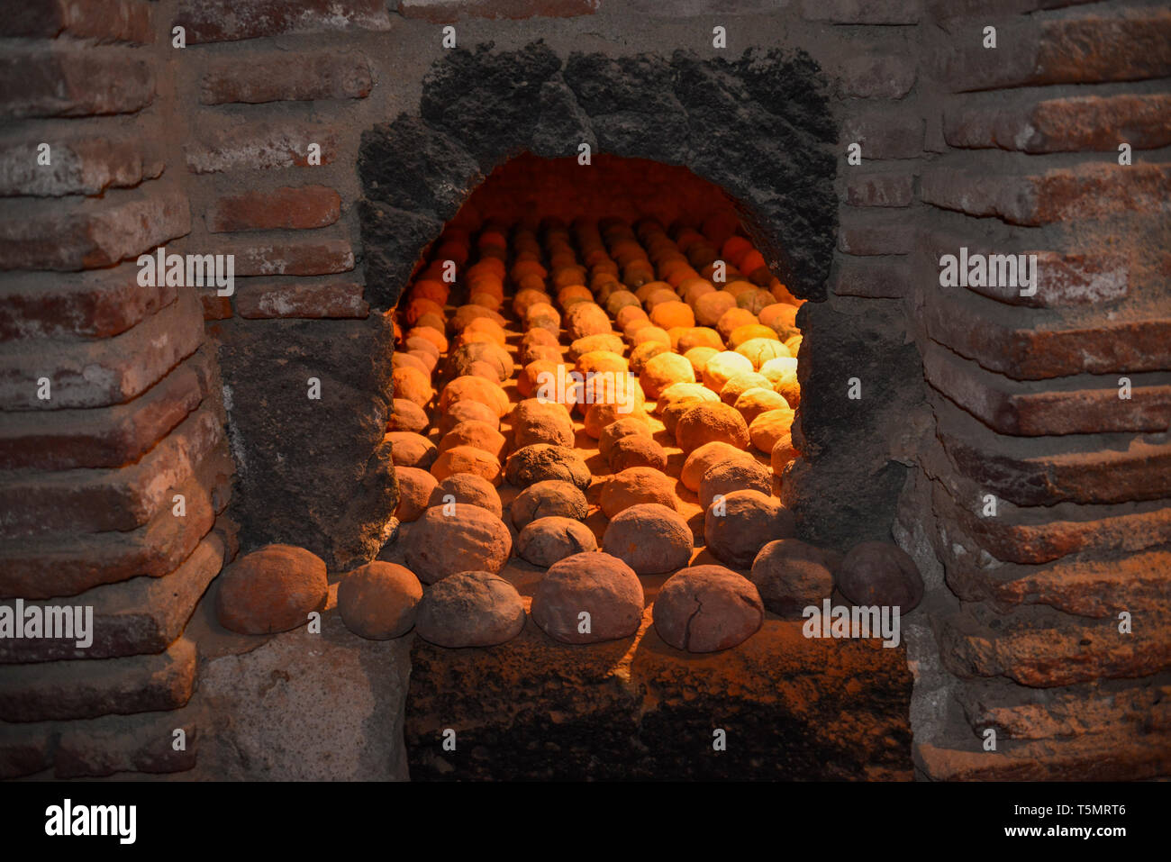 15th century bread being baked in the Catalan Forteresse de Salses, near Perpignan in the south of France. Stock Photo