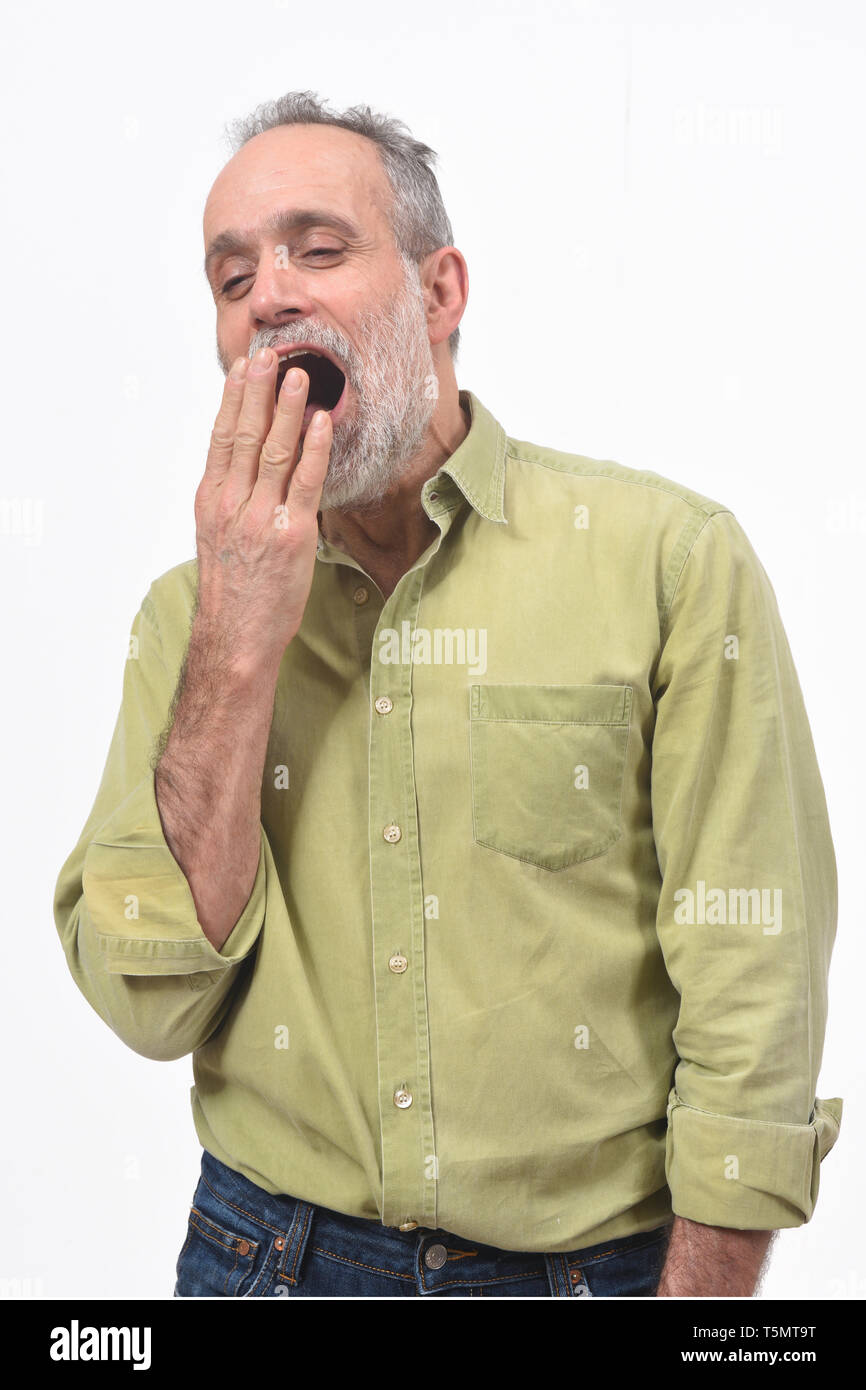 man yawning on white background Stock Photo