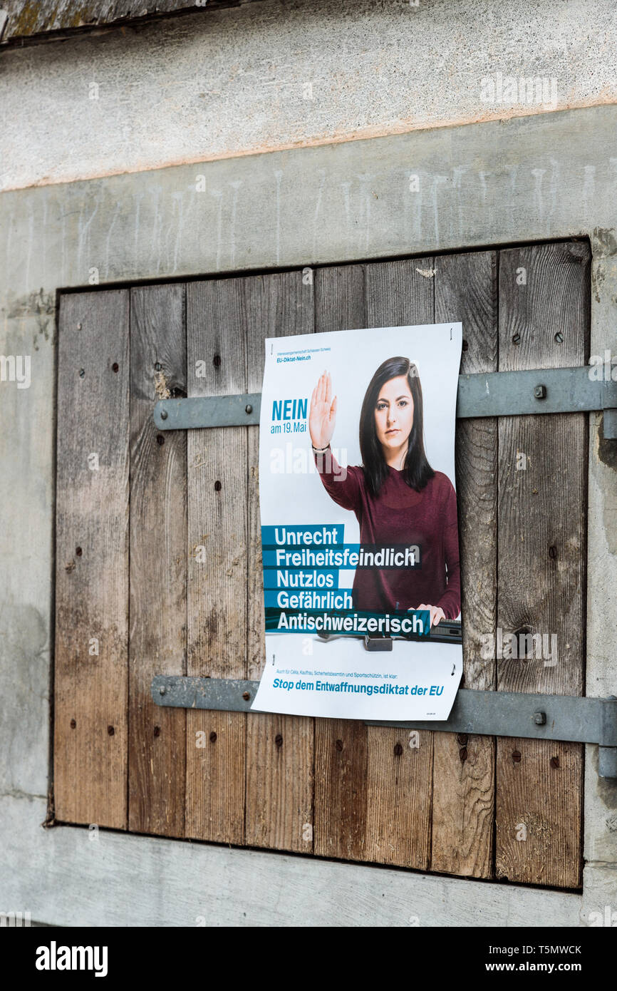Voting poster asking to vote NO to the Swiss gun law reform as proposed by the European Union. Stock Photo