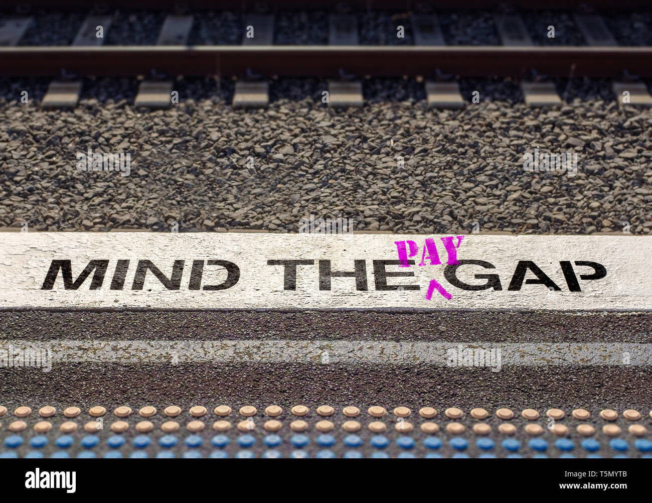 Pay gap, Mind the pay gap graffiti in pink, Gender pay equality concept – Image Stock Photo