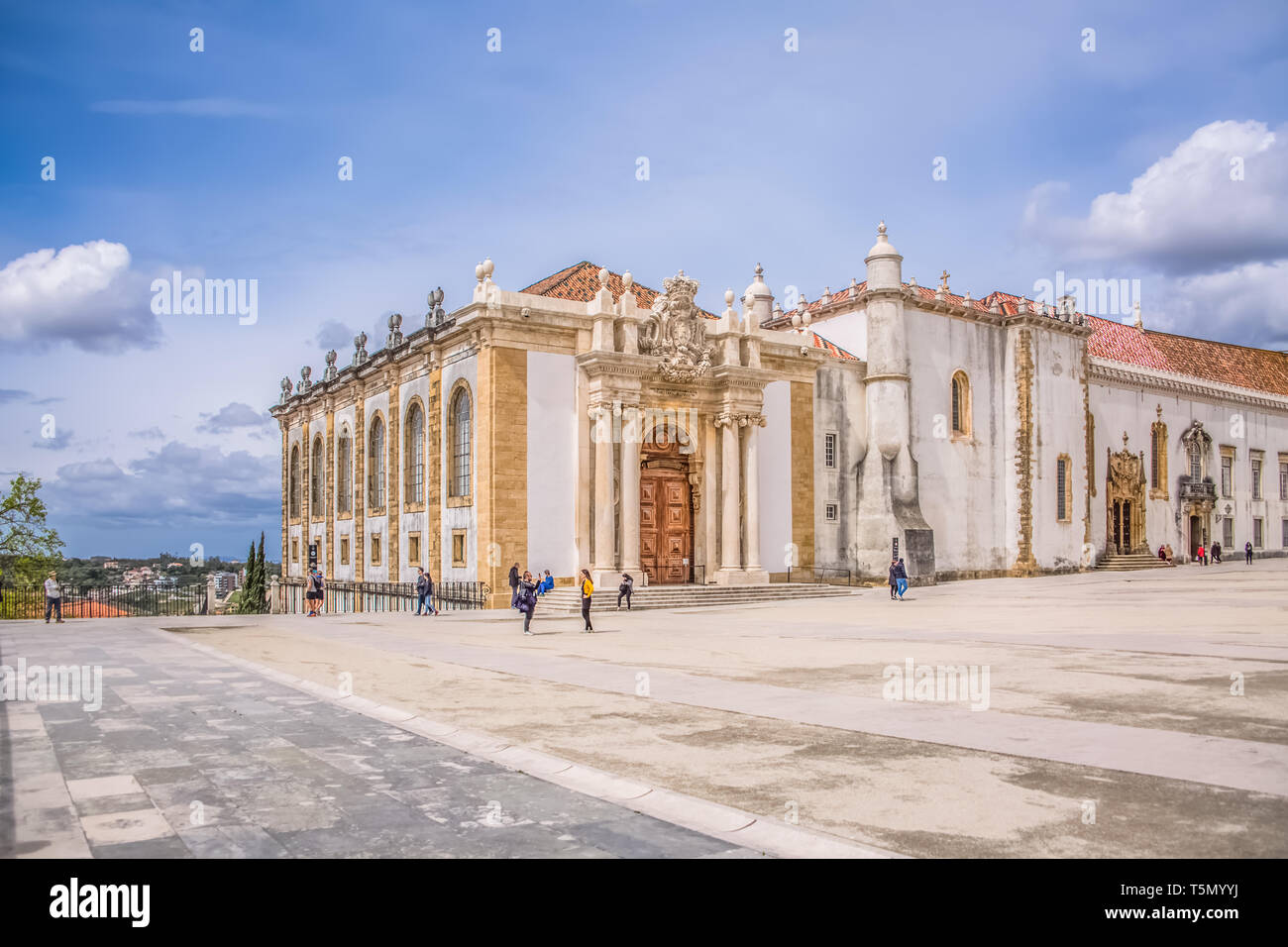 Coimbra / Portugal - 04 04 2019 : View of plaza of University of Coimbra, with tourists and building of the Joanina Library, in Coimbra, Portugal Stock Photo