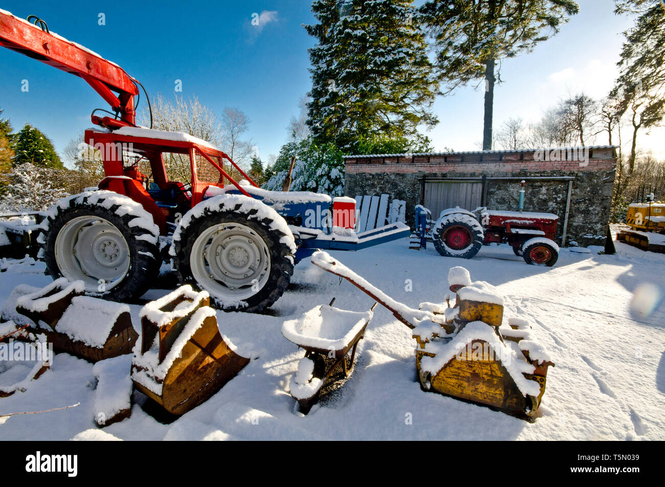 Snowy yard with tractors. Stock Photo