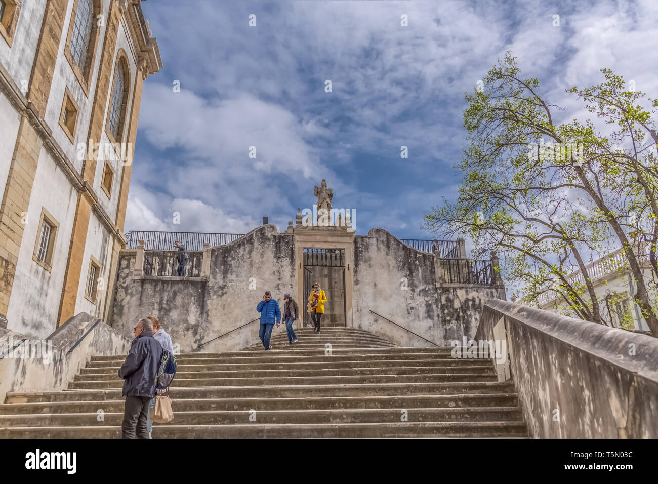 Coimbra / Portugal - 04 04 2019 : View of stairway of Minerva, gives access to the plaza of the University of Coimbra, people tourists in scene, in Co Stock Photo