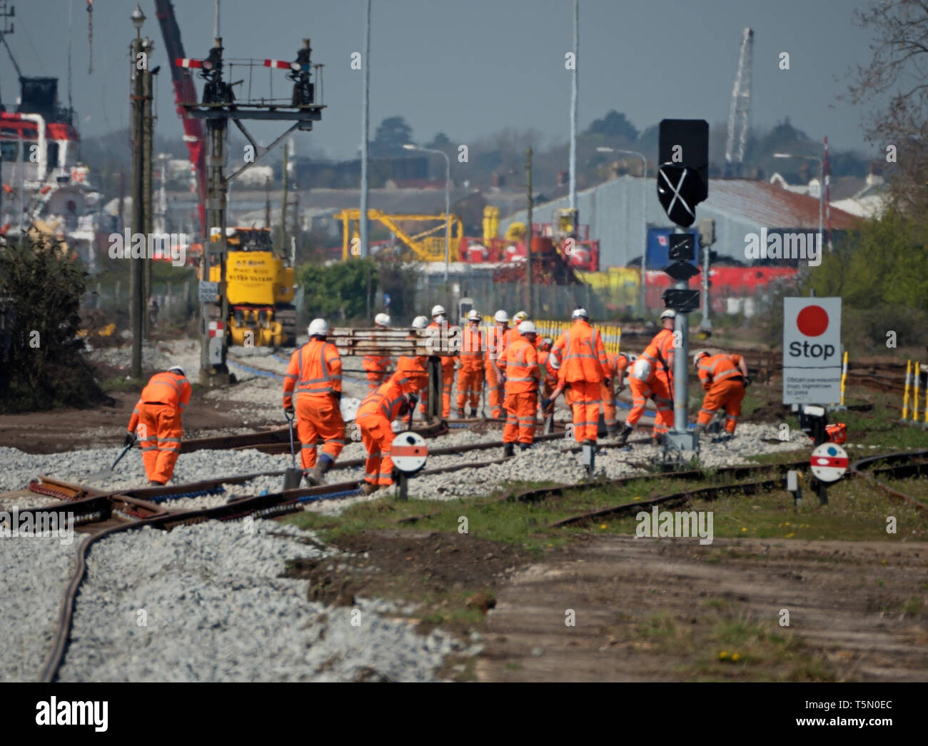 Gang of railway workers replacing signalling track, Lowestoft, Suffolk, United Kingdom Stock Photo