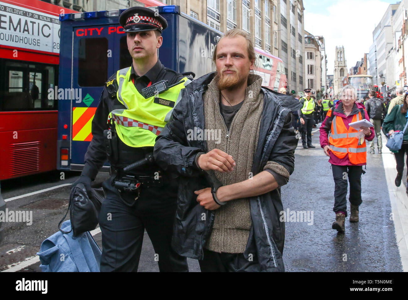 Police officer are seen arresting an environmental activist from Extinction Rebellion Movement Group on Fleet Street during the protest. The eleventh day of the ongoing protest demanding decisive action from the UK Government on the environmental crisis. Stock Photo