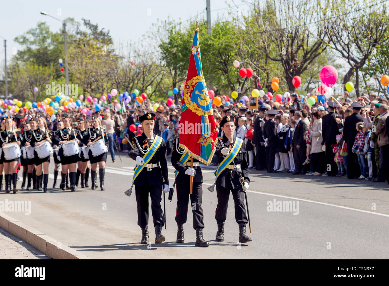 Russia, Nakhodka, 05/09/2017. Cadets in parade uniform with military flag march on parade on annual Victory Day on May 9. Holiday in honor of victory  Stock Photo