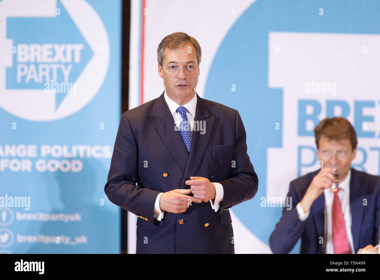 Nigel Farage speaking, watched by Richard Tice at the Brexit Party Rally held at Albert Hall Conference Centre, Nottingham. Stock Photo