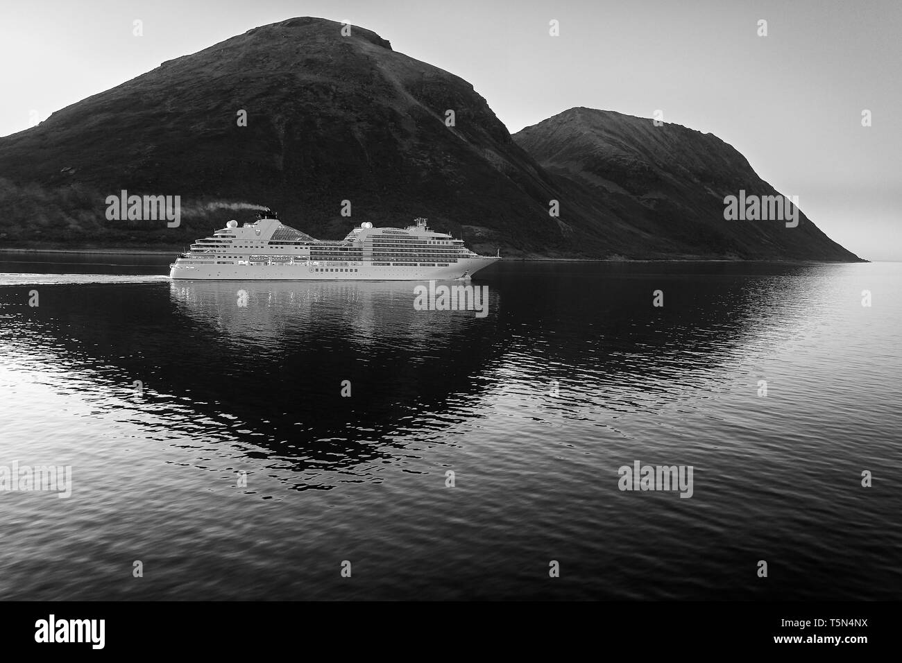 Black And White Photo Of The Cruise Ship, Seabourn Ovation, Sailing Through The Lauksundet, Close To Skjervøy, North Of The Arctic Circle. Norway. Stock Photo