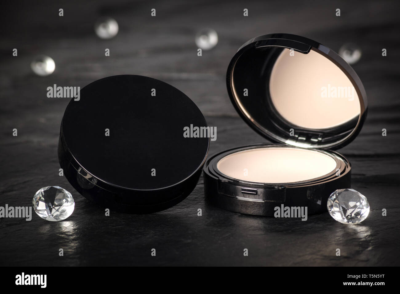 Make-up Powder open compact with Black Background Stock Photo
