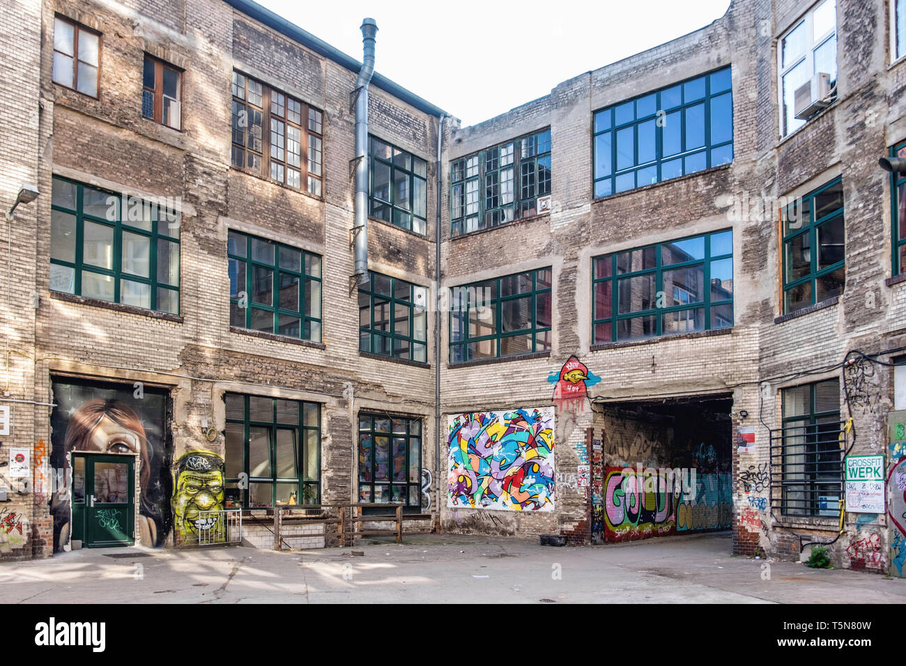 Wedding, Berlin. Inner courtyard of dilapidated old industrial building next to Panke river at Gerichtstrasse 23. Residential & business use. Stock Photo