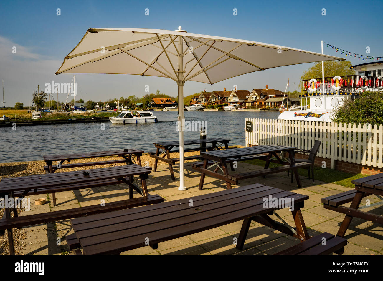 Outdoor Wooden Bench Seating Under The Shade Or A Parasol