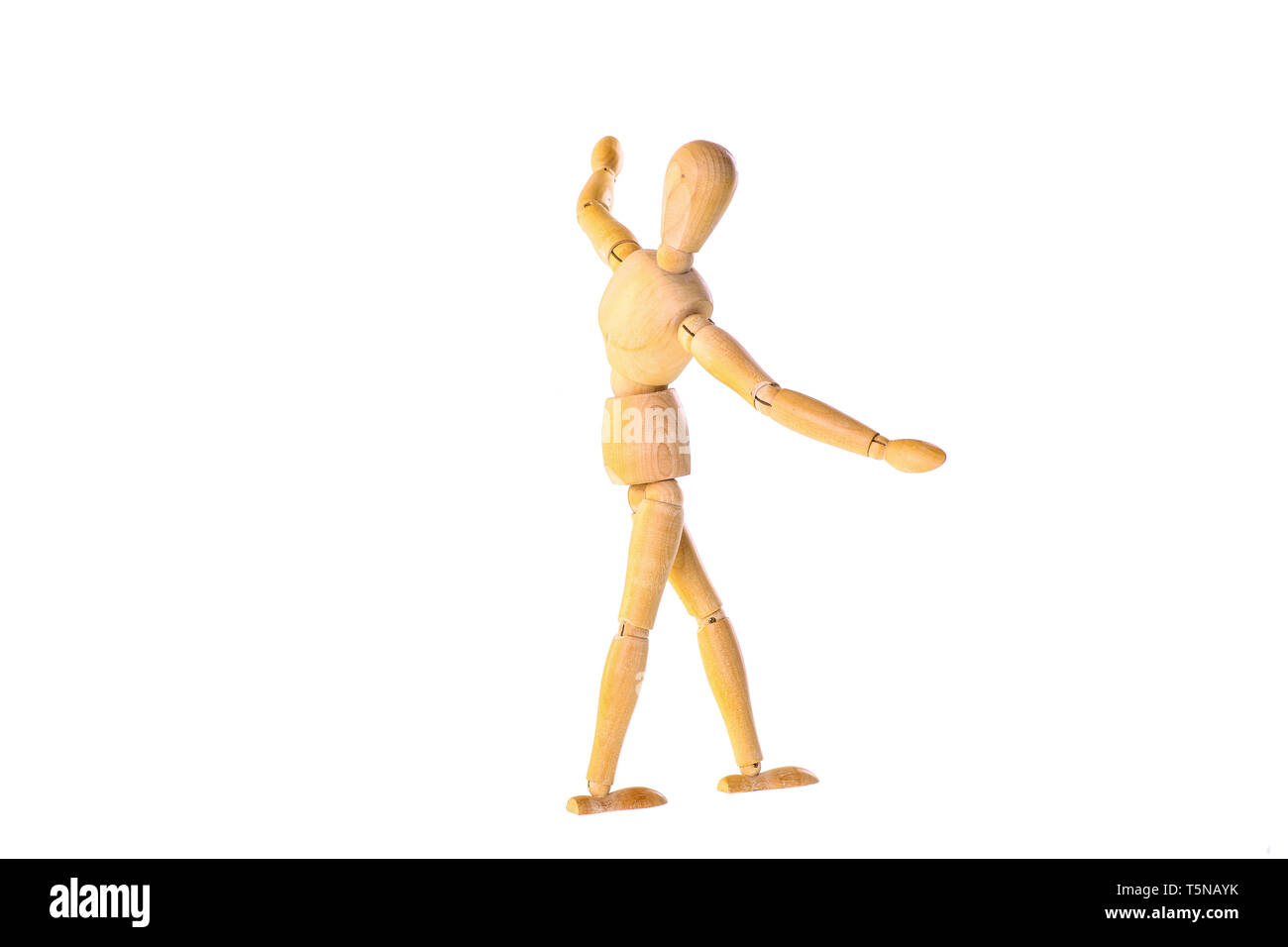 Wooden dummy in the balance - isolated on a white background Stock Photo