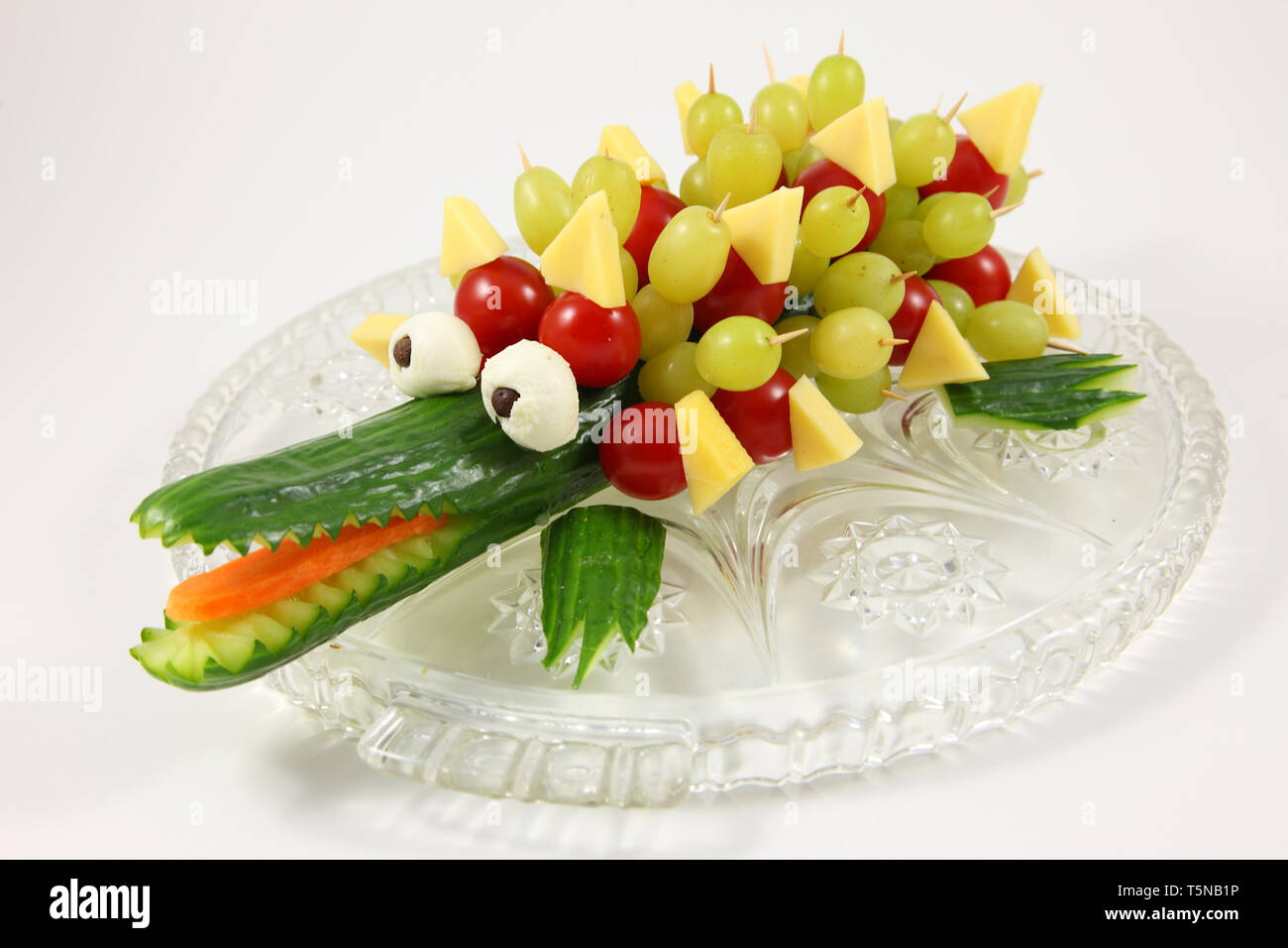 A crocodile carved out of a cucumber. Stock Photo