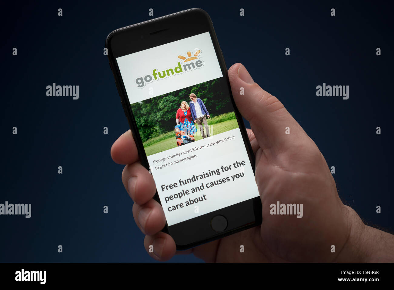 A Man Looks At His Iphone Which Displays The Go Fund Me Logo Editorial Use Only Stock Photo Alamy A Man Looks At His Iphone Which Displays The Go Fund Me Logo Editorial Use Only Stock Photo Alamy