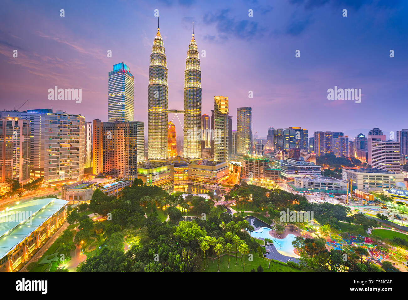 Kuala Lumpur, Malaysia park and skyline at dusk. Stock Photo