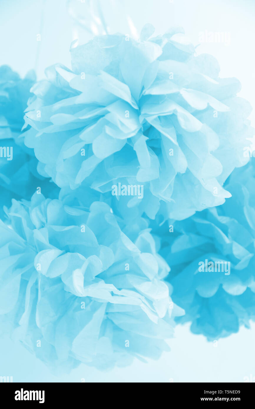 Paper flowers at the boy baby shower party. Baby shower celebration concept. Festive party