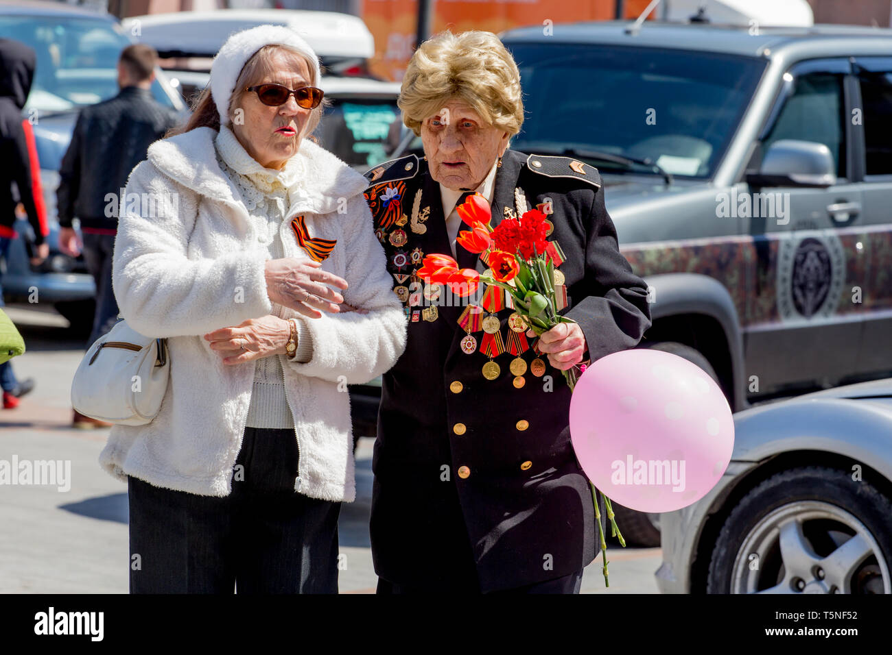 Russia, Vladivostok, 05/09/2018. Old woman, veteran and hero of Great Patriotic War between USSR and Nazi Germany (1941-1945). Annual Victory Day on M Stock Photo