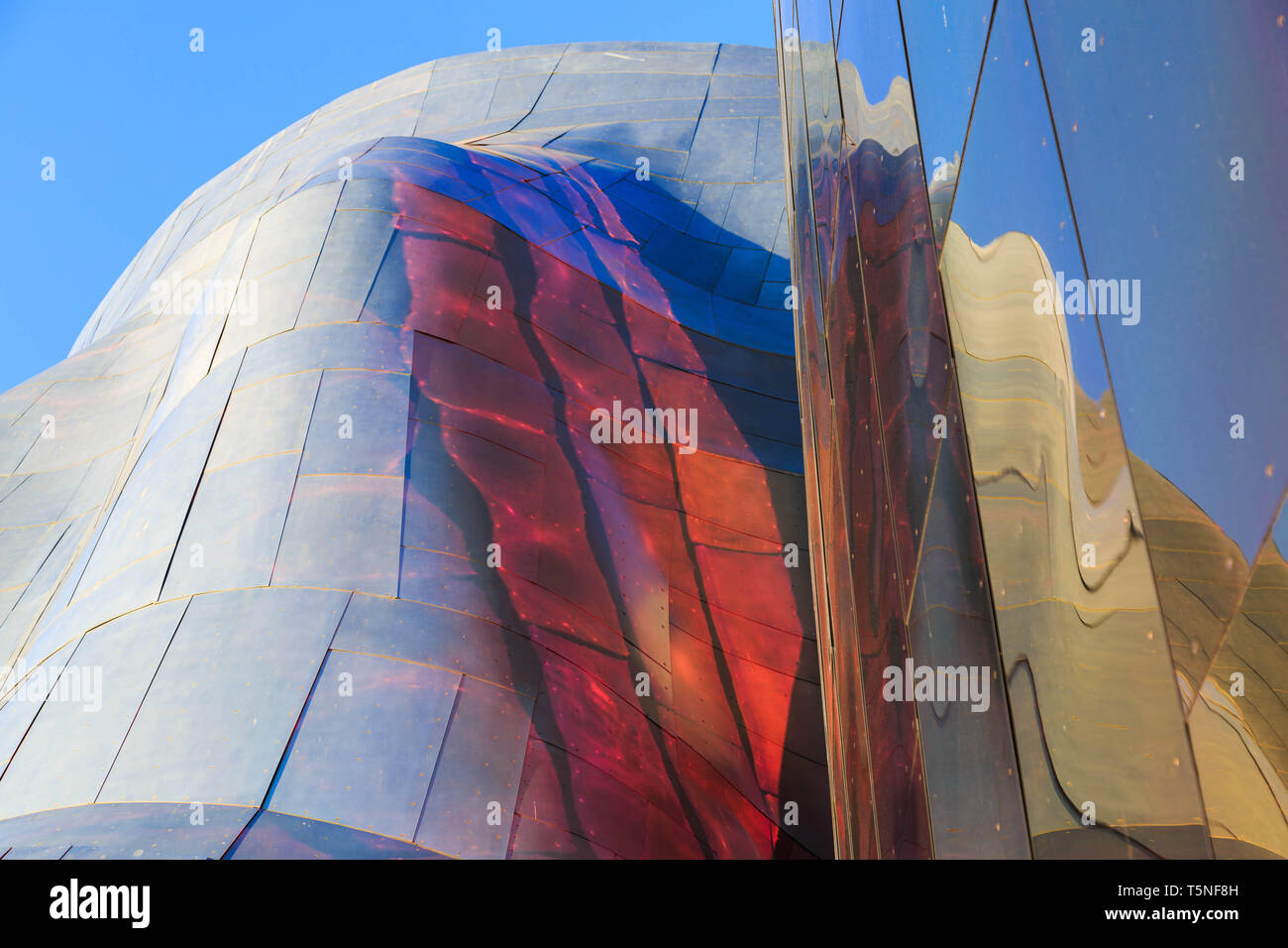 A partial view of the Museum of Pop Culture building structure creating interesting reflections on its surface at Seattle Center, Seattle, USA. Stock Photo