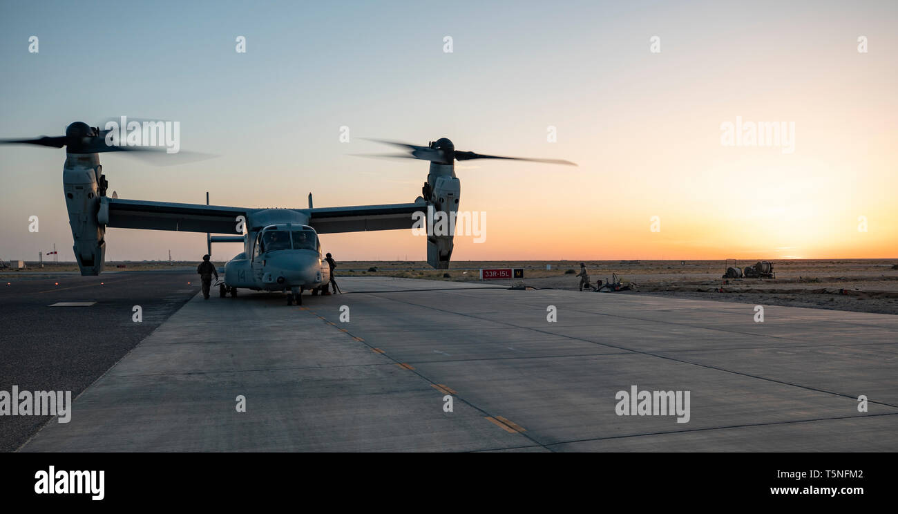 A U.S. Marine MV-22 Osprey with the 22nd Marine Expeditionary Unit hot refuels prior to beginning a tail gun shoot during Marine a MEU exercise. The training allowed Marines with Marine Medium Tiltrotor Squadron 264 (Reinforced) to familiarize themselves with operating the weapon during flight and maintain combat readiness. Marines and Sailors with the 22nd MEU and Kearsarge Amphibious Ready Group are currently deployed to the U.S. 5th Fleet area of operations in support of naval operations to ensure maritime stability and security in the Central region, connecting the Mediterranean and the Pa Stock Photo