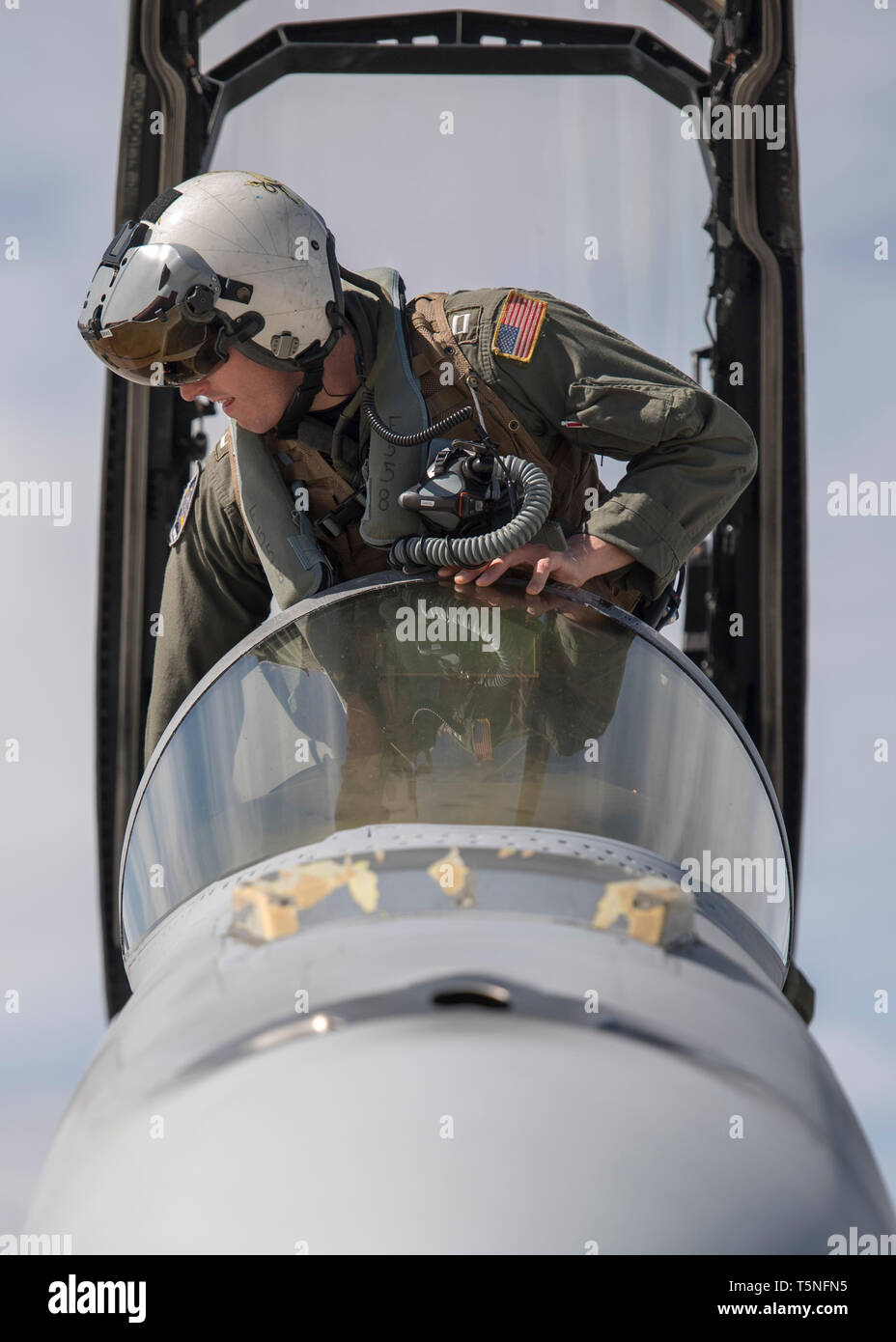 A U.S. Navy pilot from Strike Fighter Squadron 32 based ashore at Naval Air Station Oceana, Virginia Beach, Virginia prepares to fly an F/A-18F Super Hornet at Gowen Field, Boise, Idaho April 23, 2019. The pilots are training with A-10 Thunderbolt IIs assigned to the 190th Fighter Squadron. (U.S. Air National Guard photo by Master Sgt. Joshua C. Allmaras) Stock Photo