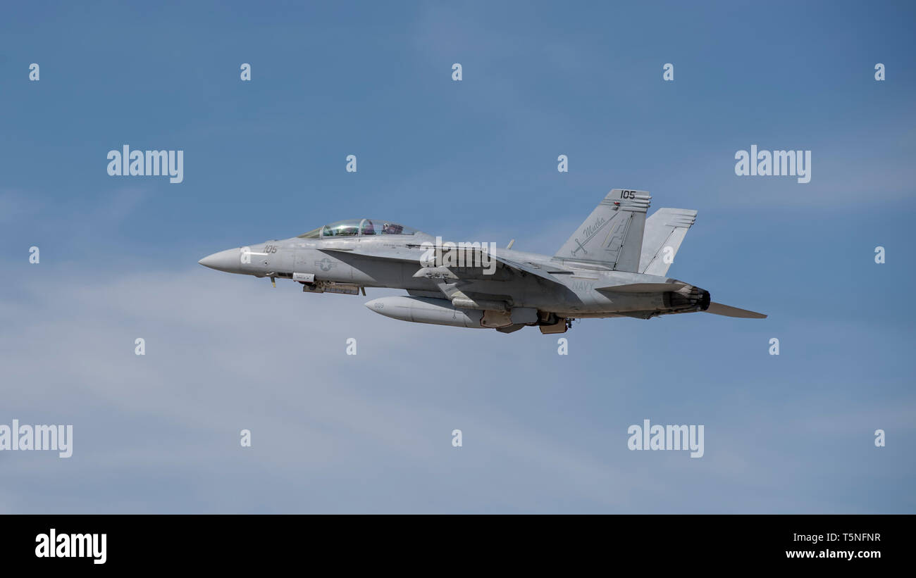 An F/A-18F Super Hornet assigned to the U.S. Navy’s Strike Fighter Squadron 32 based ashore at Naval Air Station Oceana, Virginia Beach, Virginia takes off from Gowen Field, Boise, Idaho on April 23, 2019. The aircraft is in Idaho to train with A-10 Thunderbolt IIs from the 190th Fighter Squadron. (U.S. Air National Guard photo by Master Sgt. Joshua C. Allmaras) Stock Photo
